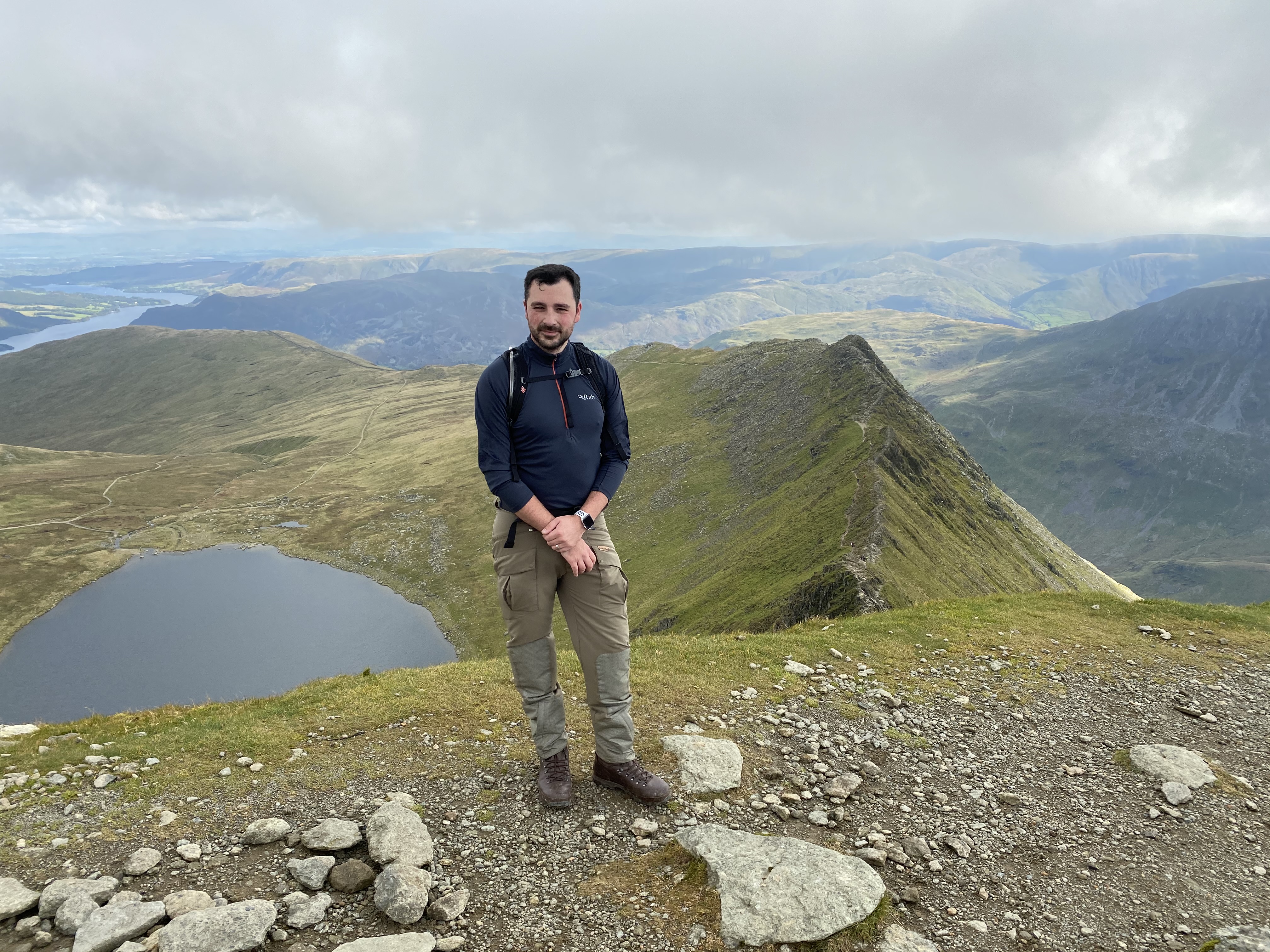 Nicky at the top of Helvellyn, with Striding edge in the background